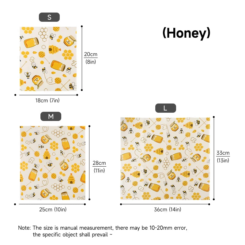 Three yellow honey-patterned reusable beeswax food wrap sheets in S, M, and L sizes for plastic-free kitchen storage.