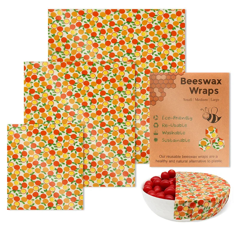 Reusable beeswax food wrap set with orange citrus pattern for plastic-free kitchen storage.