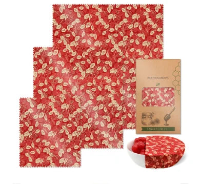 Red leaf-patterned reusable beeswax food wrap for plastic-free kitchen storage.