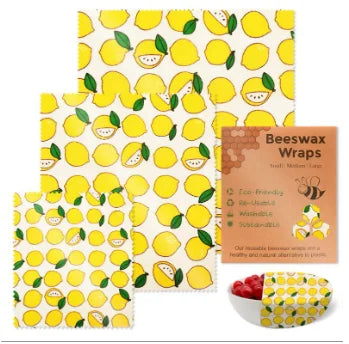 Reusable beeswax food wrap in yellow lemon pattern for plastic-free kitchen storage.