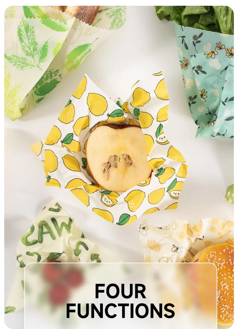 Reusable beeswax food wrap for plastic-free kitchen storage, featuring colorful fruit and floral patterns wrapping various foods.