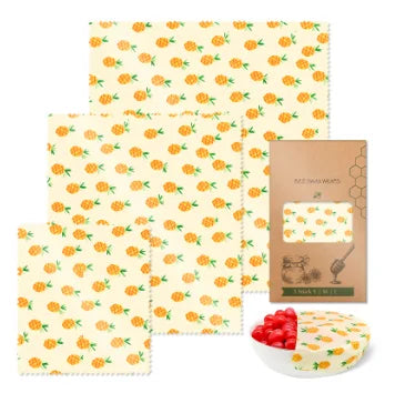 Reusable beeswax food wrap set with yellow pineapple pattern for plastic-free kitchen storage.