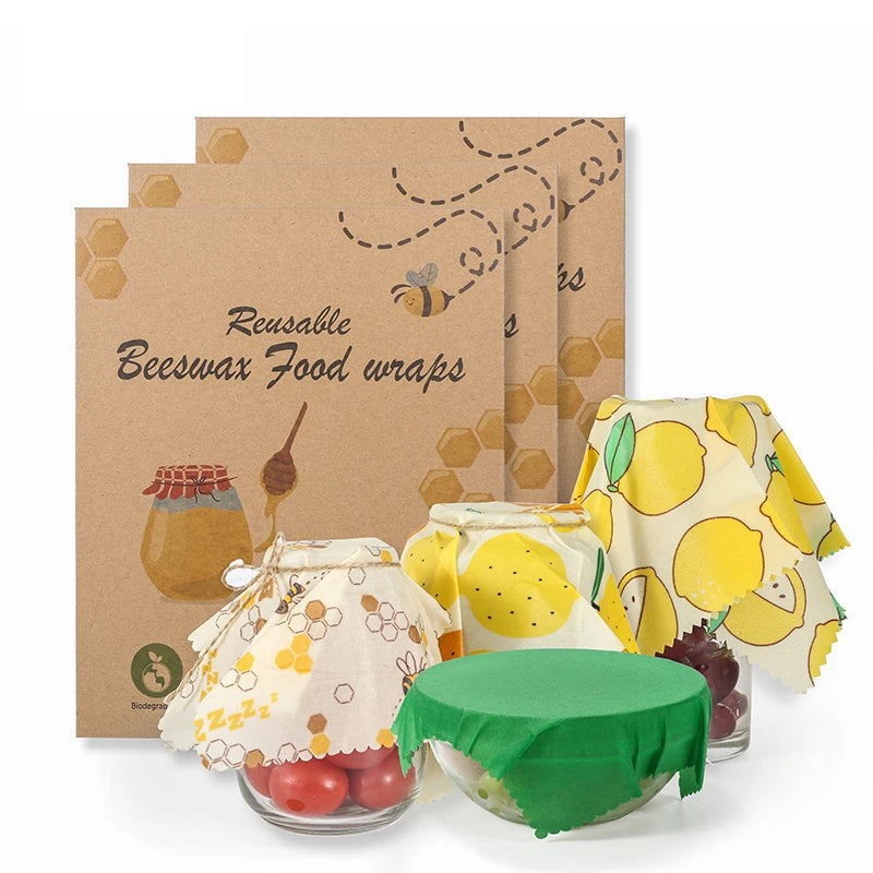 Reusable beeswax food wrap set with yellow, green, and patterned designs, ideal for plastic-free kitchen storage.
