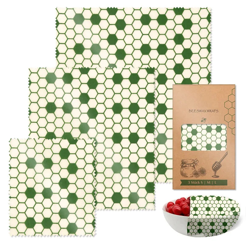 Reusable beeswax food wrap set with green and white honeycomb pattern, in rectangular shapes for plastic-free kitchen storage.